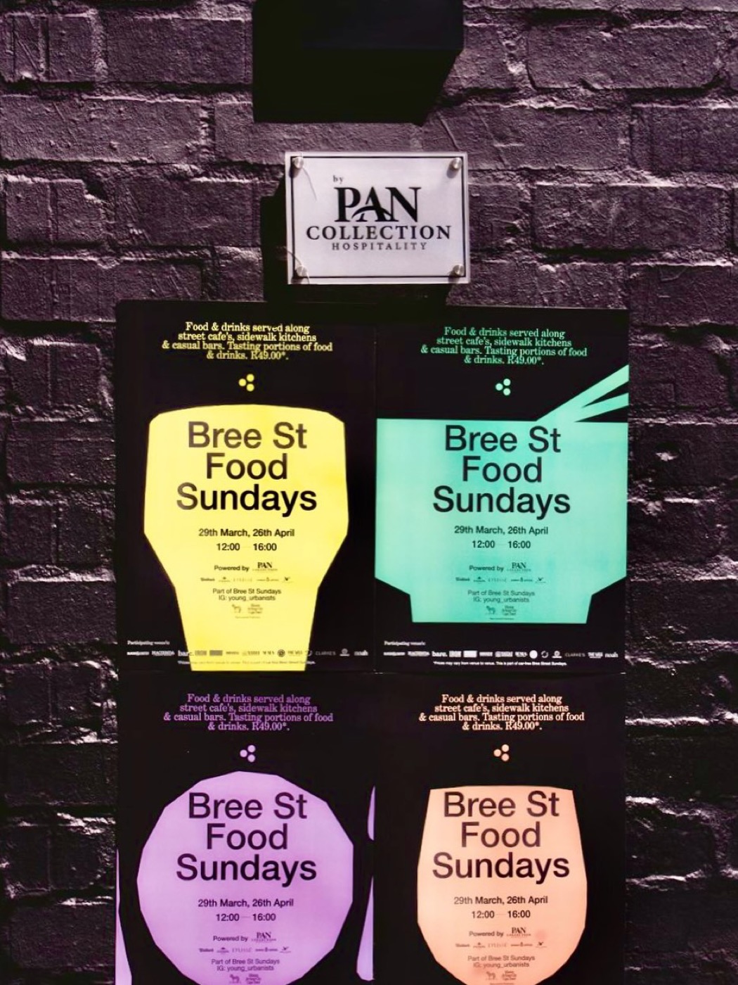 Bree Street Food Sundays posters on brick wall